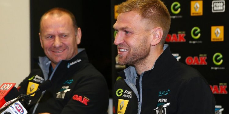 Port coach Ken Hinkley sits