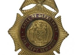 Gold-toned badge owned by chief for the division from 1955-1958.