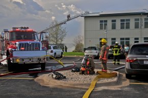 Volunteer firefighters, including Chief Philip Stittleburg, fight a structure fire in La Farge, Wisconsin.